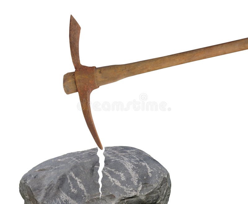 Old pick axe breaking rock isolated.