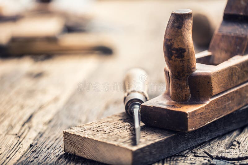 Old planer and other vintage carpenter tools in a carpentry workshop stock photos