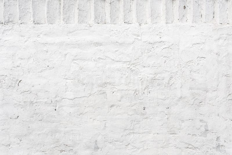 Old Plaster Wall Painted in White with Brick Pattern Stock Photo
