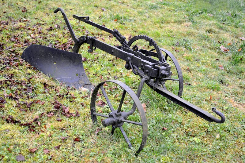 The Old Plow On Horse Draft Lies On A Grass Stock Photo - Image of ...