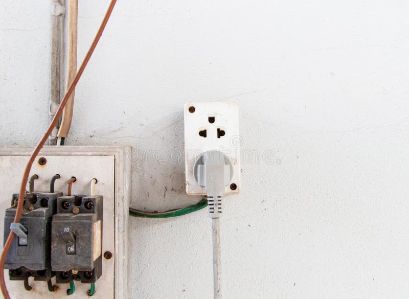 plug on wall outside kitchen