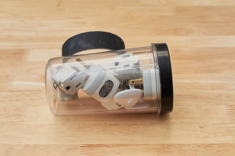 Old plugs in a storage jar stock image. Image of tools 259482511