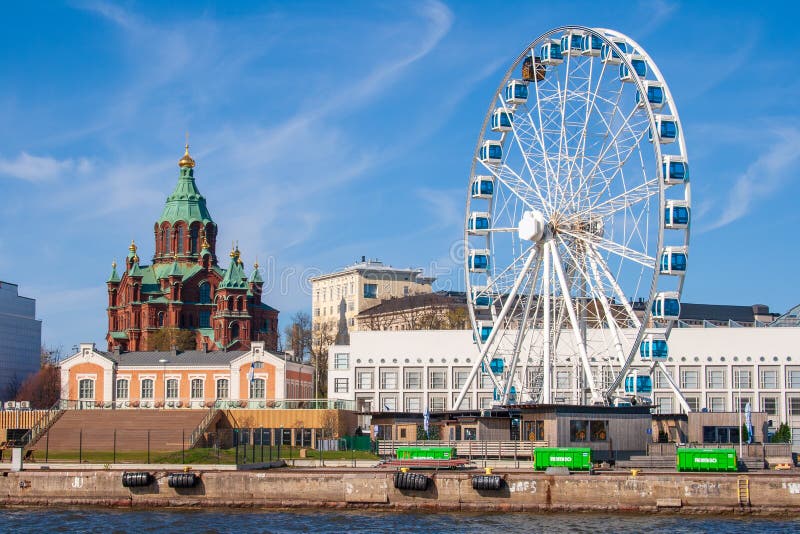 Old Port pier architecture, sightseeing ship, public sauna, Ferris wheel and Uspenski Orthodox Cathedral, Helsinki