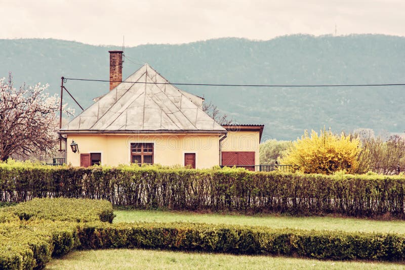 Old rail station in the natural landscape, yellow filter