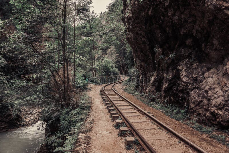 Old railroad or railway road in mountain landscape