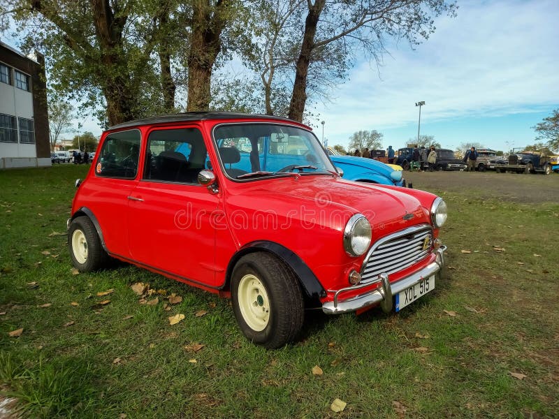 Photo of a Retro Mini Cooper Car Logo Badge on a Red Mini Cooper Car.  Editorial Photo - Image of chrome, motor: 144682971