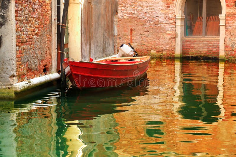 Old red boat near the old buildings in Venice, Italy stock images Old red boat near the old buildings in Venice, Italy stock images