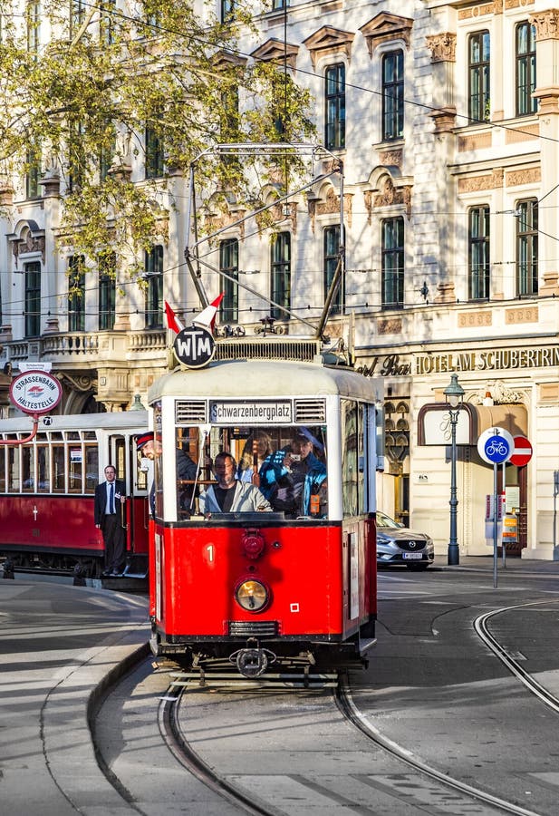 Old red tram waiting for people on the stop