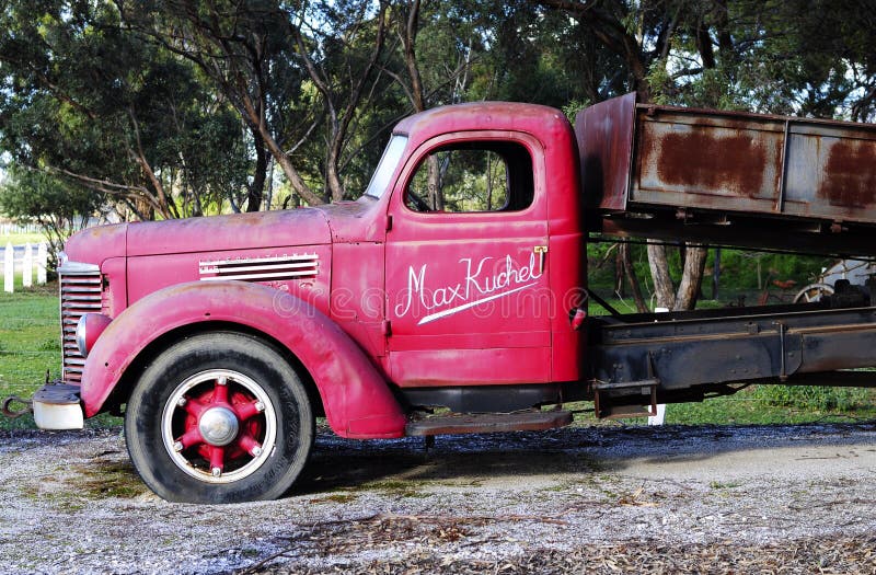 Old red vintage truck at the entrance of Kuchel estate