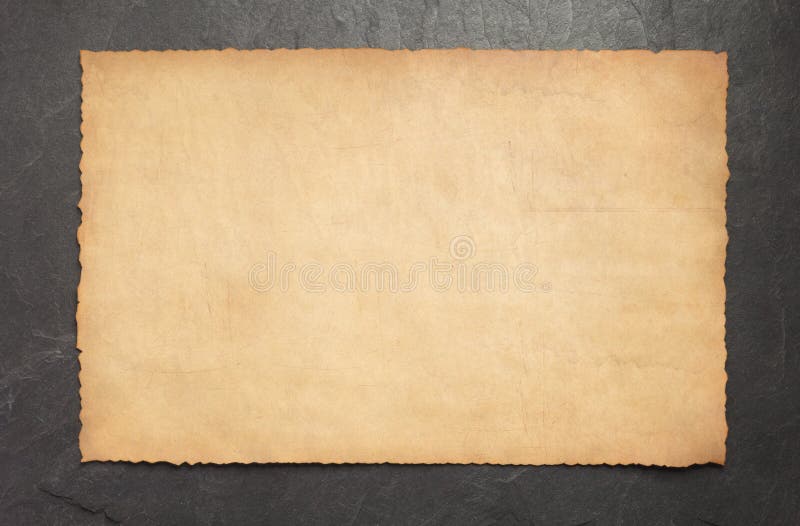 Old retro aged paper parchment on slate