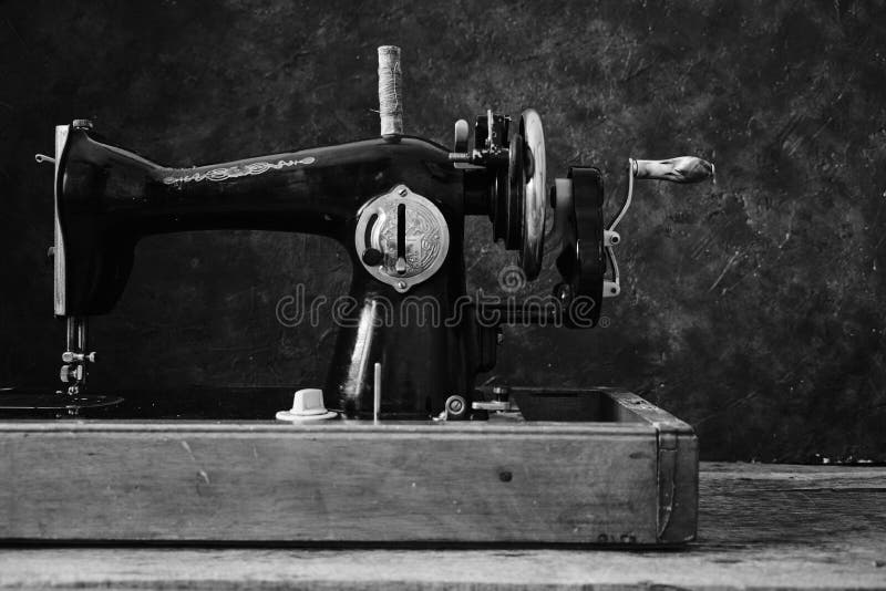 Old, Retro, Vintage Sewing Machine on a Dark Background of an Abstract