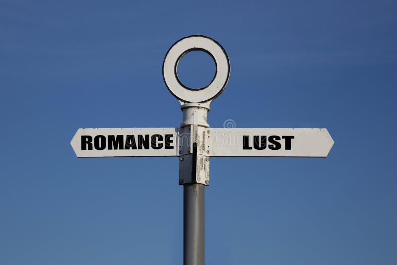 Old road sign with romance and lust pointing in opposite directions