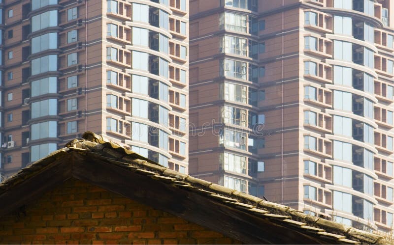 Old rooftop vs new windows stock photo