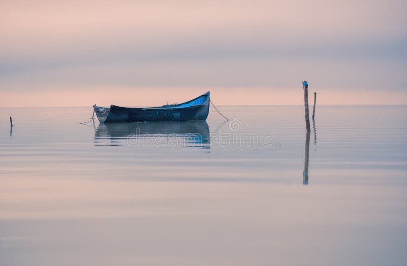 Old rowboat on the lake