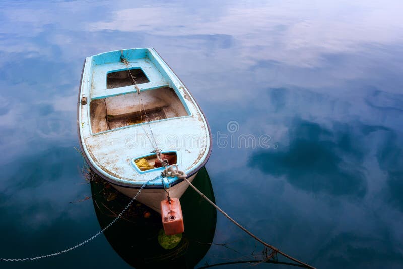 Old ruined ship moored in the river port