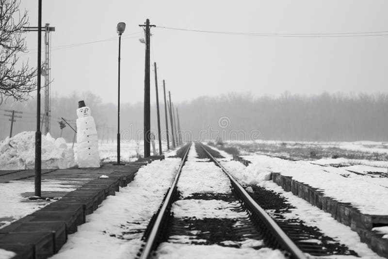 Old, rural railroads and railway station in winter