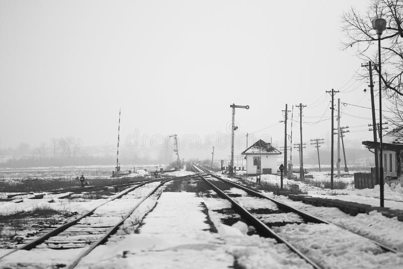 Old, rural railroads and railway station in winter