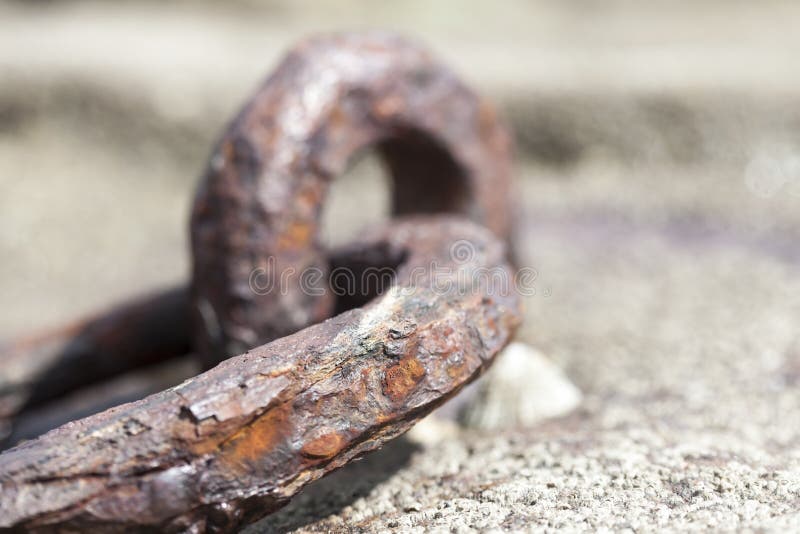 Old rusted iron ring in a harbor in france