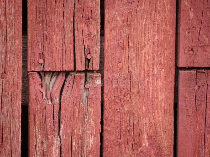 Old Rustic Red Wall Painted with Red Mulch Paint in Daylight Stock