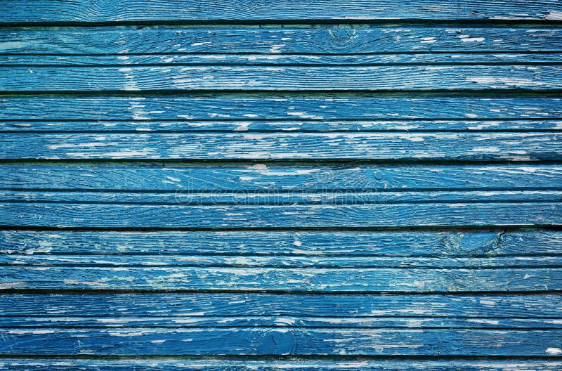 Old rustic wooden planks with blue cracked paint, vintage wall wood for background