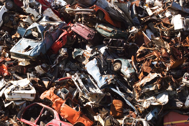 Old rusting cars in a junk yard