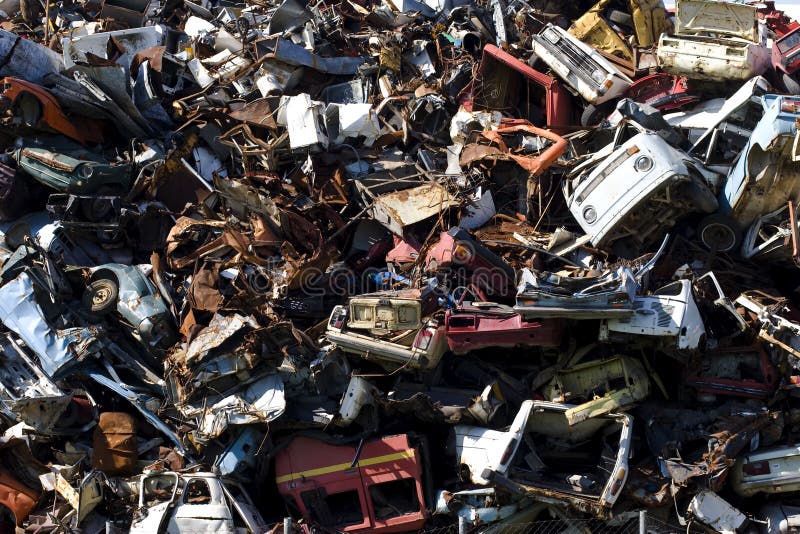 Old rusting cars in a junk yard