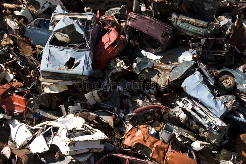 Old rusting cars in a junk yard