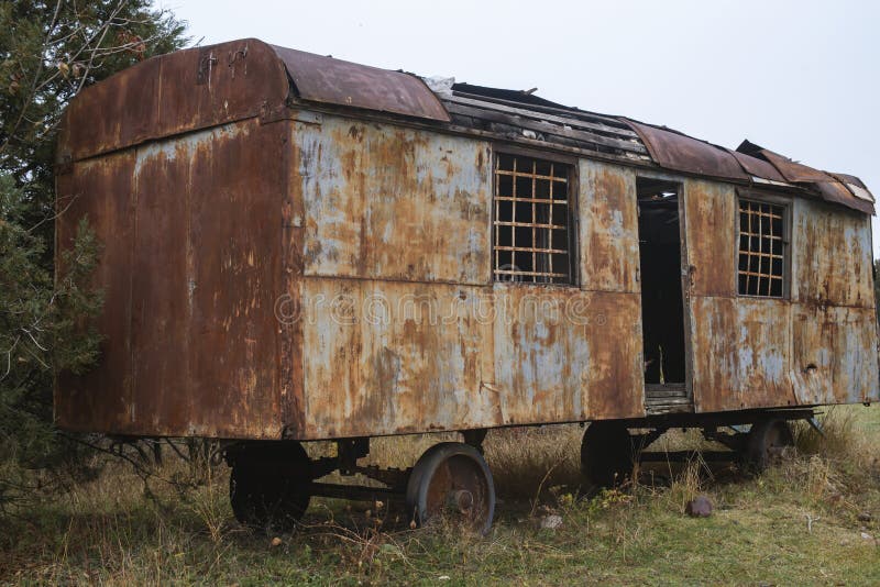 Old  rusty construction camper, trailer or wagon.