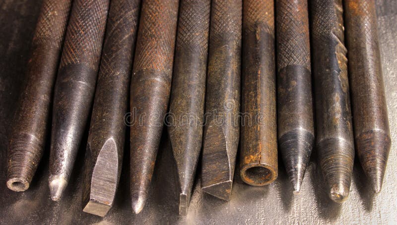 Old rusty hand iron punchers and chisels stock image