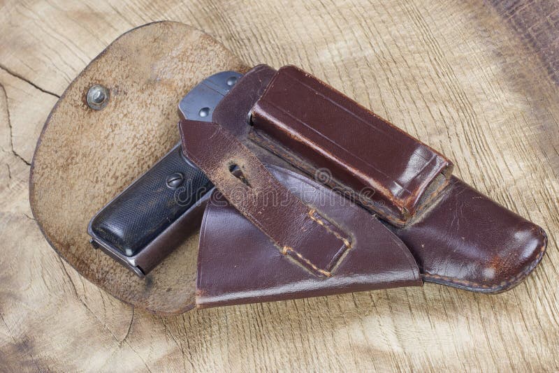 Old rusty handgun and holster