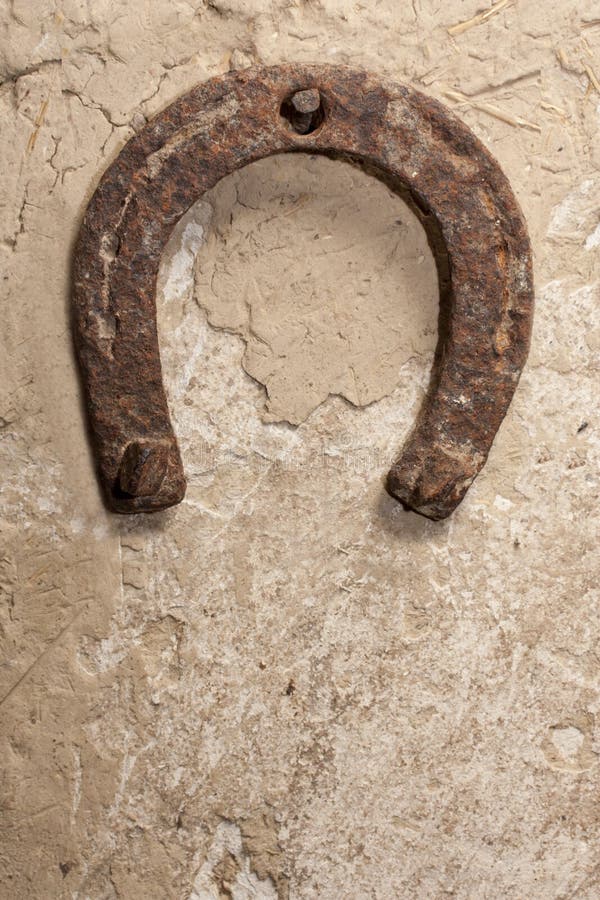 An Old Horseshoe on a Red Wall Stock Photo Image of antique, cowboy