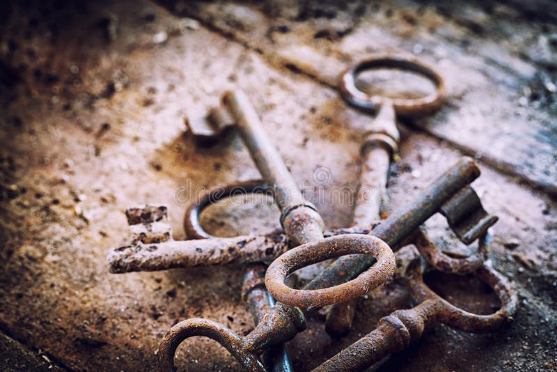 Old rusty keys on a wooden table stock images Old rusty keys on a wooden table stock images