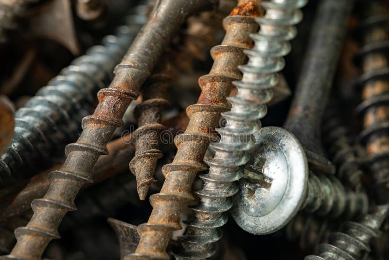 Old Rusty Screws and Nails. Background for Construction and Industry