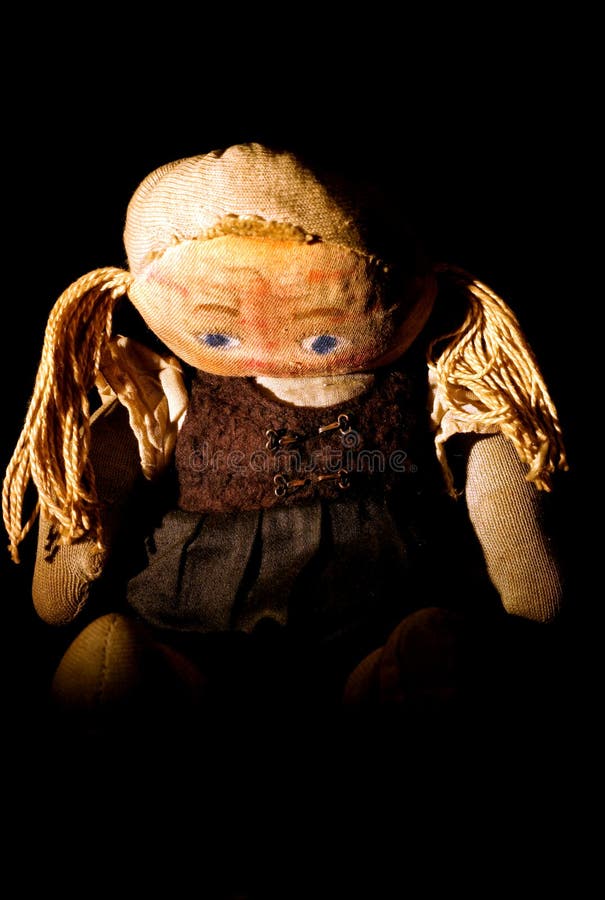 Old sad cloth doll with spot light 4