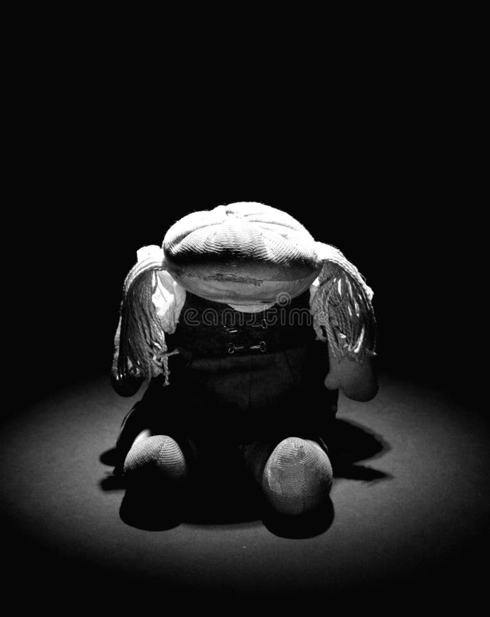 Old sad cloth doll with spot light B/W 2