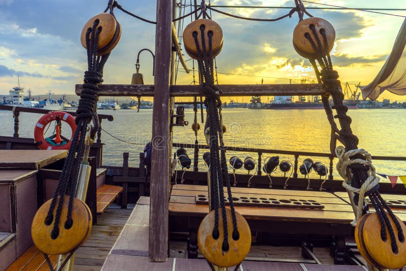 Old sailboat, detail closeup of wooden cleats with ropes. Sunset royalty free stock photos Old sailboat, detail closeup of wooden cleats with ropes. Sunset royalty free stock photos