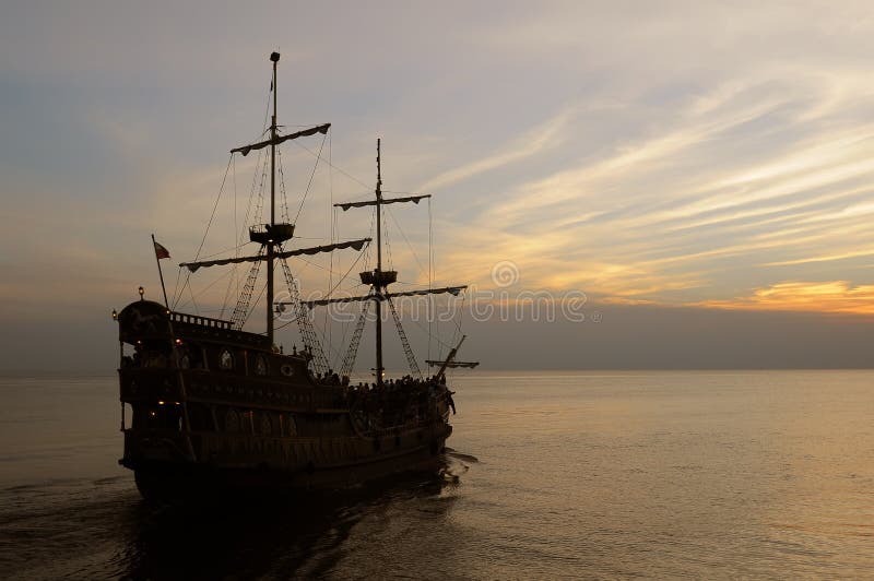 Old sailing ship at dusk