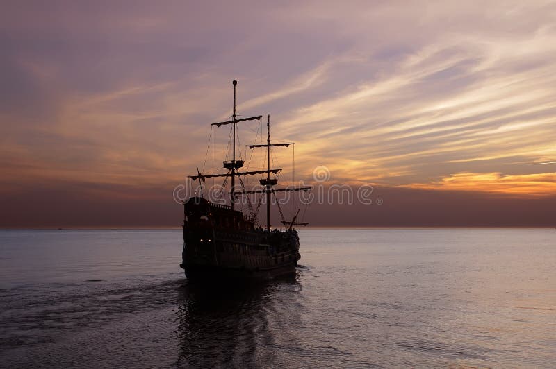 Old sailing ship at dusk