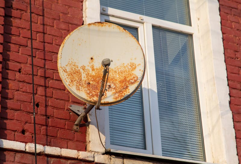 An Old Satellite Dish on the Wall Stock Photo Image of white, video