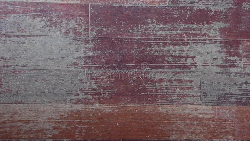 Old scratched hardwood flooring in need of maintenance