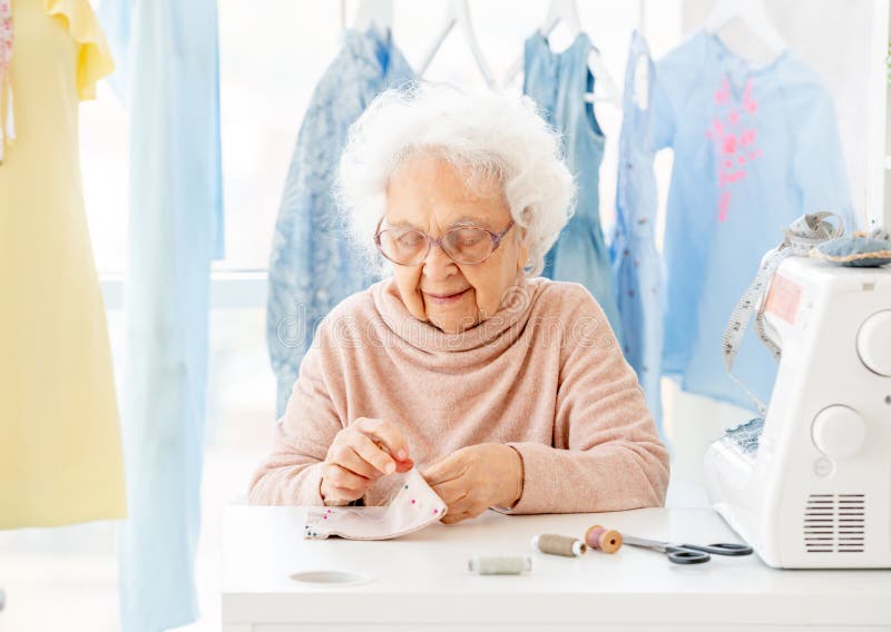 Old seamstress working stock photo. Image of courses - 162848490