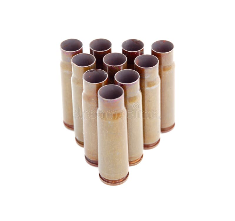 Closeup of triangle of old used 7,62 mm shells (cartriges) of AK47 isolated on white. Closeup of triangle of old used 7,62 mm shells (cartriges) of AK47 isolated on white