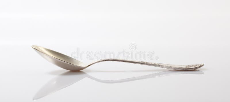 Old Silver Spoon on a white background