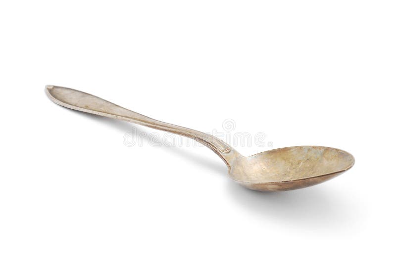 Old silver spoon on white