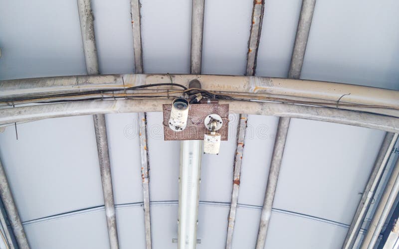 An Old small CCTV camera on the roof of aisle. Old cctv monitor stock images, royalty-free photos and pictures