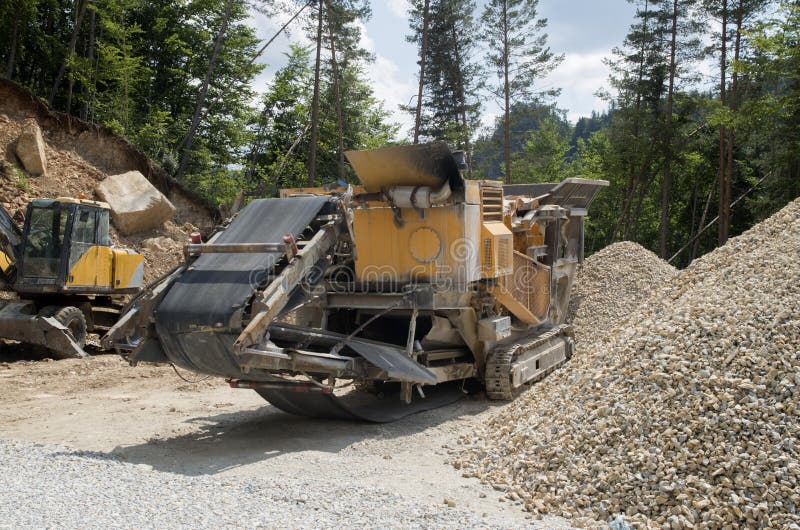 Mobile Stone Crusher Machine By The Construction Site Or Mining Quarry For  Crushing Old Concrete Slabs Into Gravel And Subsequent Cement Production.  Stock Photo, Picture and Royalty Free Image. Image 130474849.