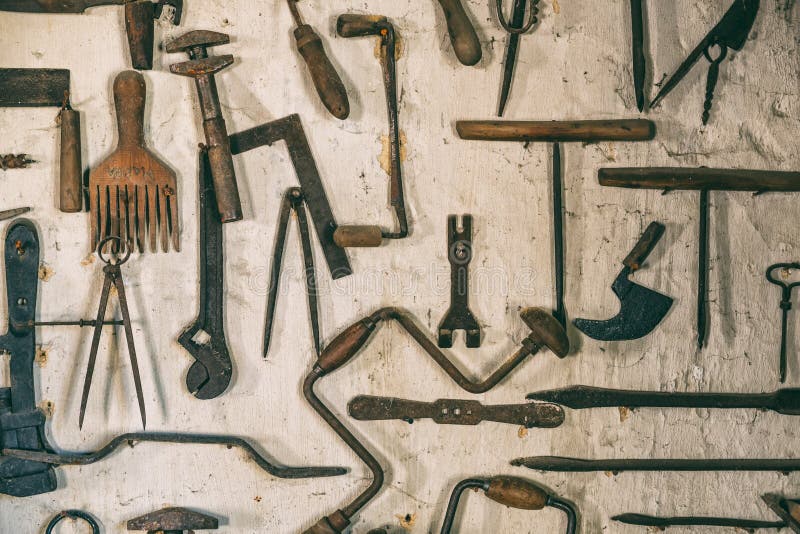 Smithy tools on the wall stock photo. Image of hand 132687002