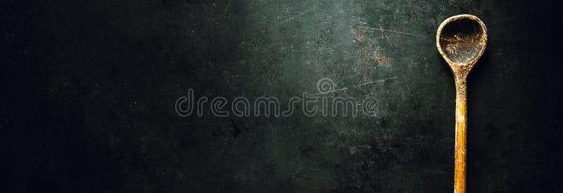 Old spoon on dark table royalty free stock photography Old spoon on dark table royalty free stock photography