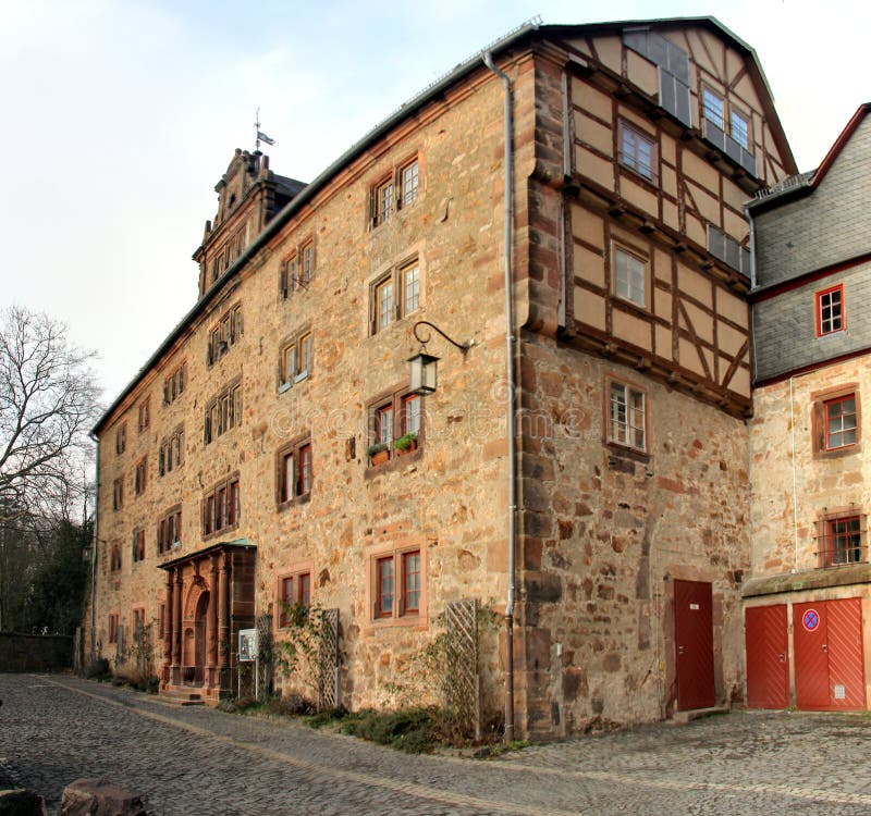 Old stables building of Landgrafen Palace, currently housing Collegium Philippinum of the the University of Marburg, panoramic shot in sunset light, Marburg, Germany - January 29, 2023. Old stables building of Landgrafen Palace, currently housing Collegium Philippinum of the the University of Marburg, panoramic shot in sunset light, Marburg, Germany - January 29, 2023