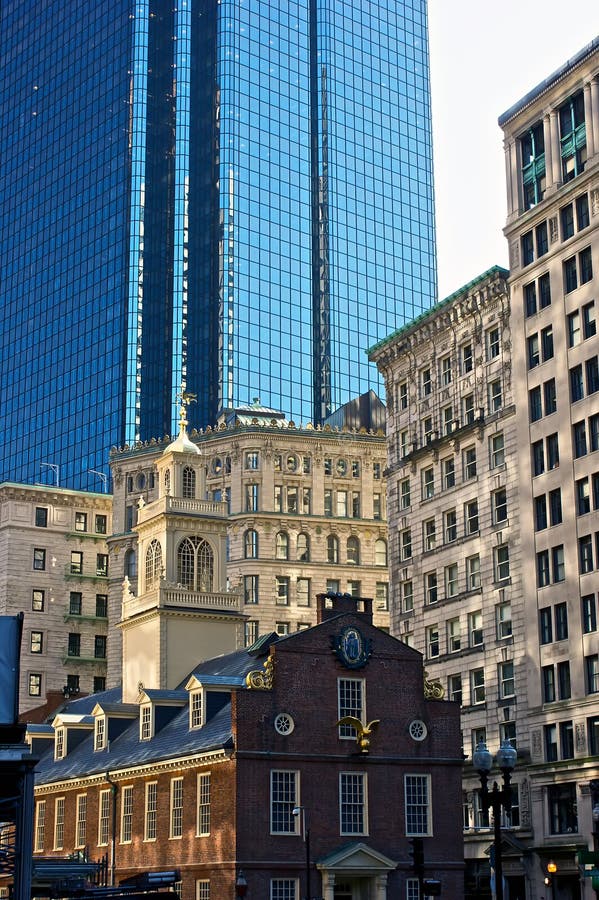 Old state house is dwarfed by surrounding buildings in downtown boston massachusetts